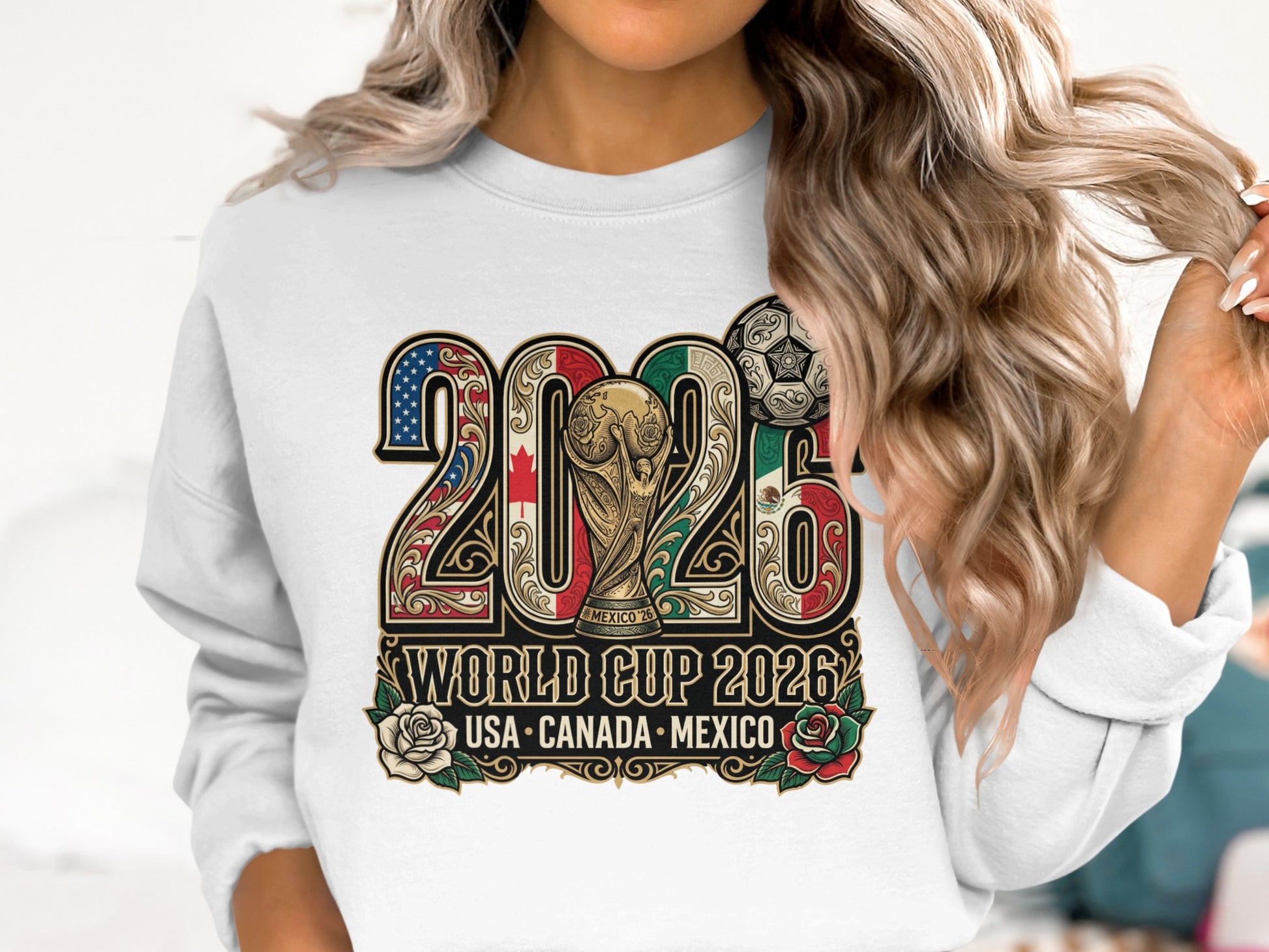 White sweatshirt with "2026 World Cup USA Canada Mexico" and trophy design.
