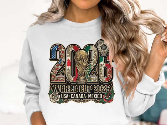 White sweatshirt with "2026 World Cup USA Canada Mexico" and trophy design.