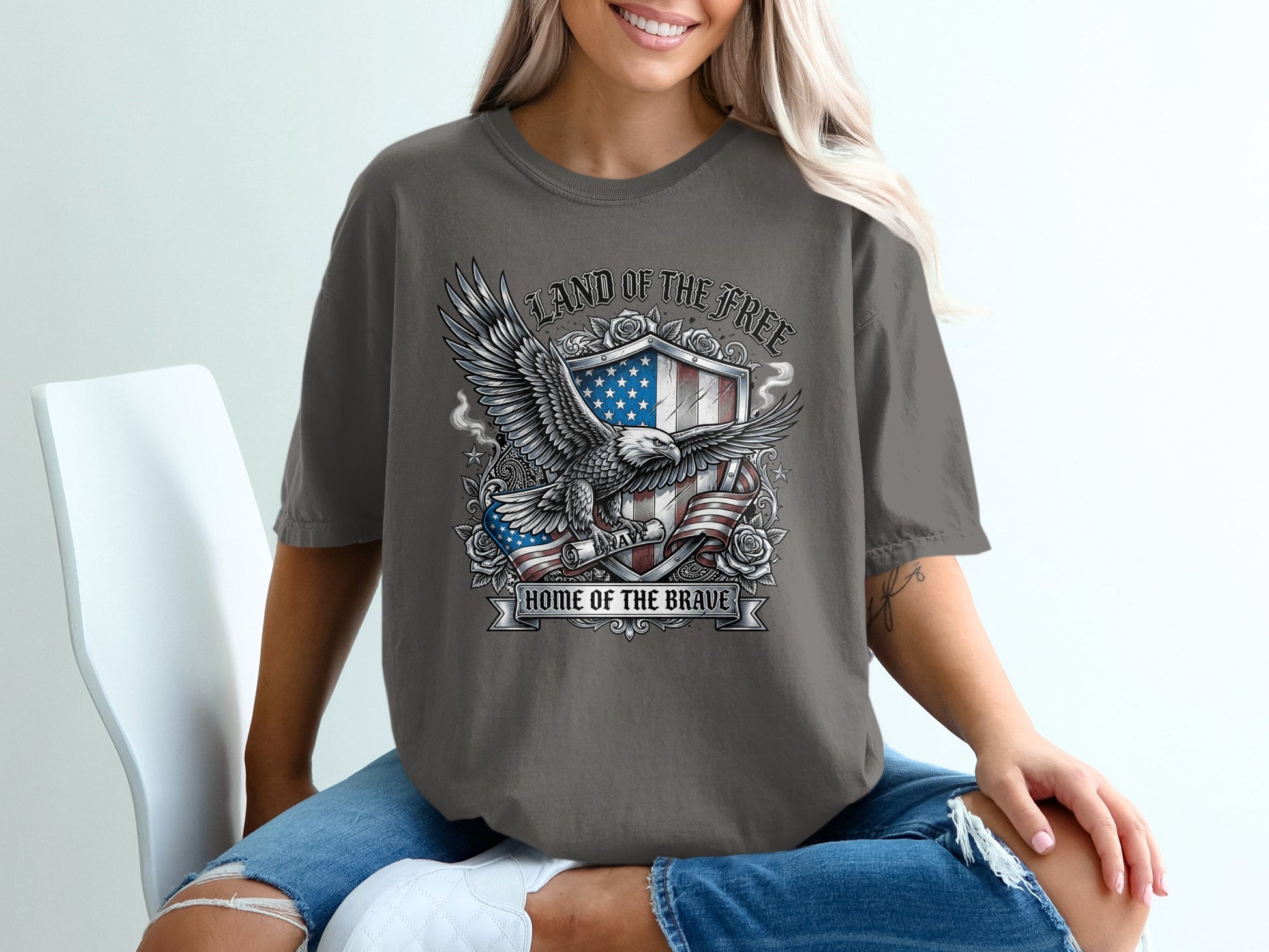 T-shirt with eagle, shield, and flag graphic: "Land of the Free, Home of the Brave."