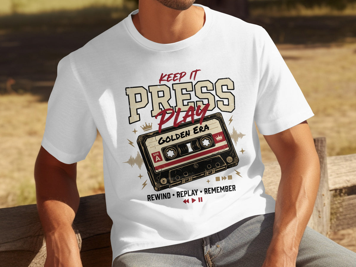 White t-shirt with "KEEP IT PRESS PLAY GOLDEN ERA" text and cassette tape graphic.
