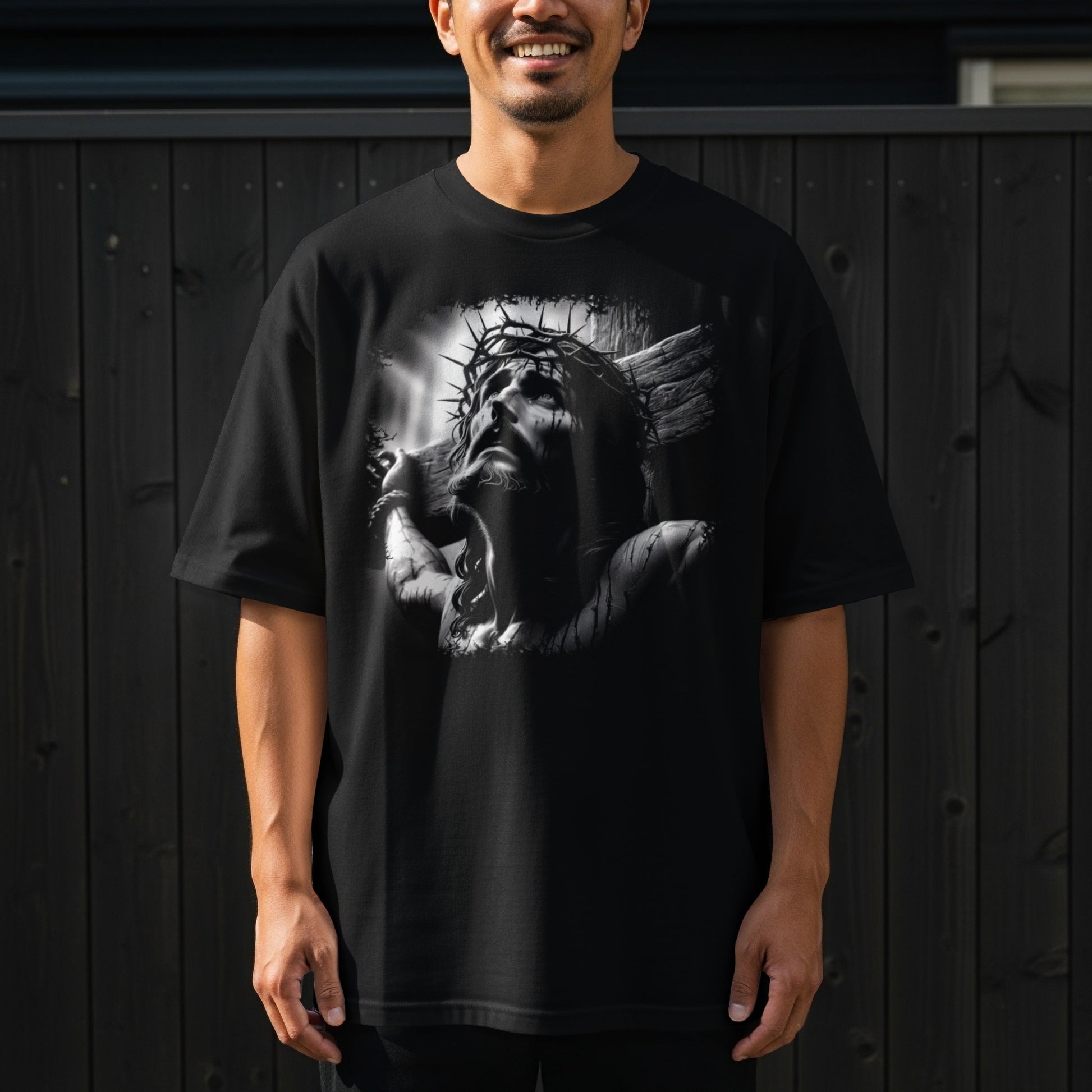 Black t-shirt with a distressed graphic of Jesus Christ on the cross.