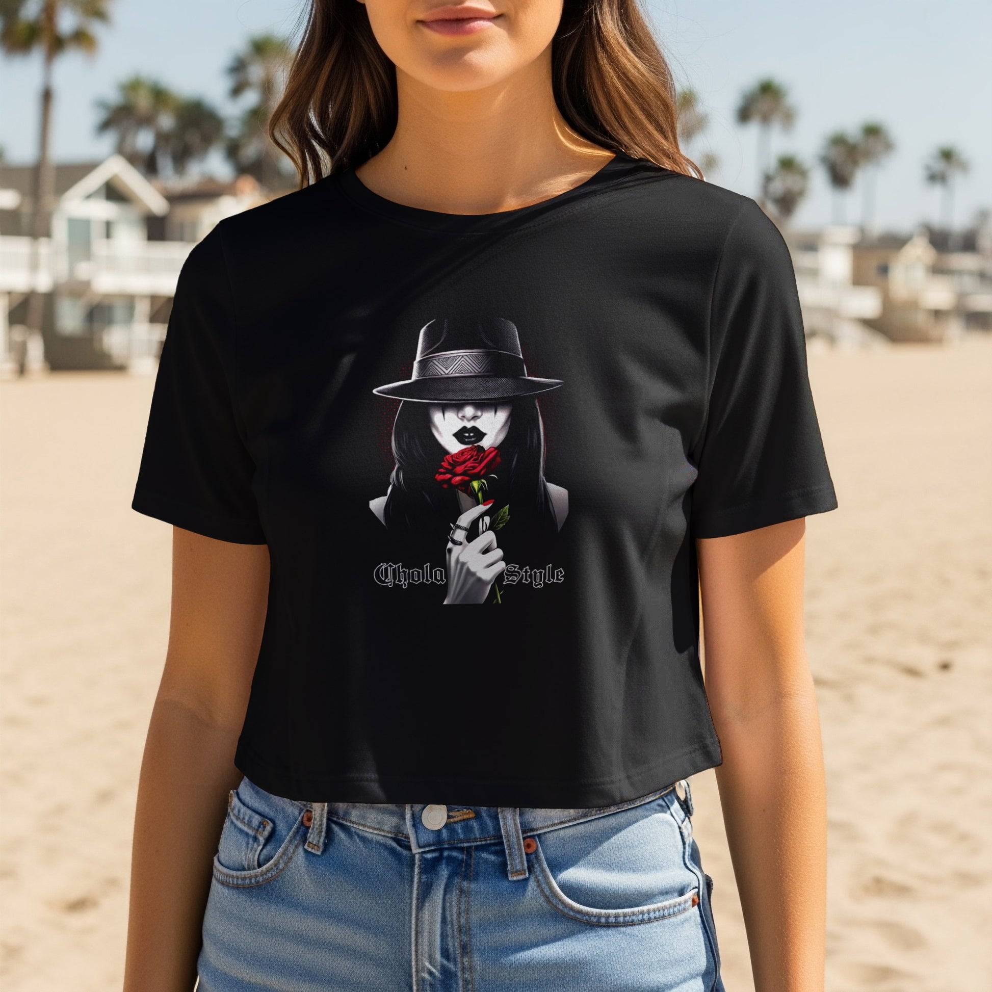 Black t-shirt featuring a graphic of a woman in a hat holding a red rose.