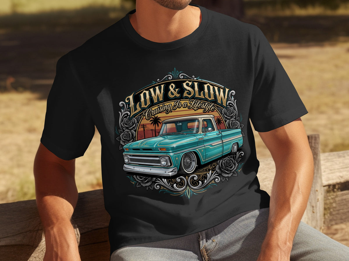 Black t-shirt with graphic of teal lowrider truck and "Low & Slow Cruising Is A Lifestyle" text.