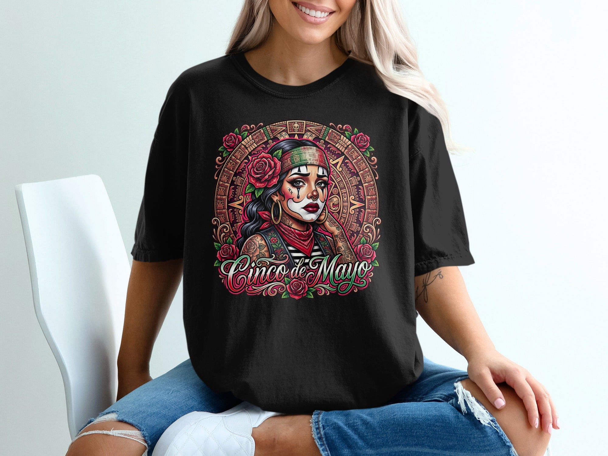 Black t-shirt with a woman's face adorned with roses and a Cinco de Mayo calendar design.