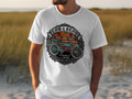 White t-shirt with graphic of a blue lowrider bicycle and text 