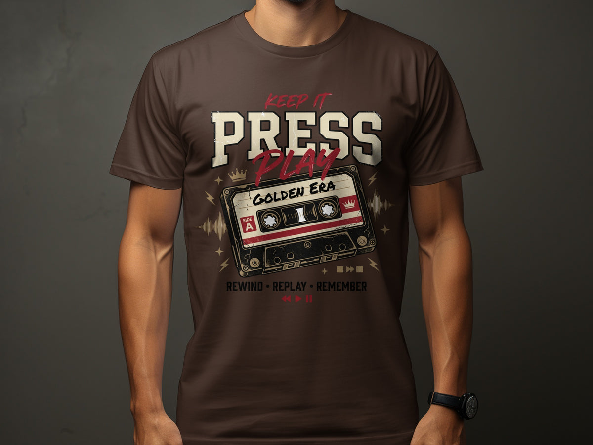 Brown t-shirt with "Keep It Press Play Golden Era" and cassette tape graphic.