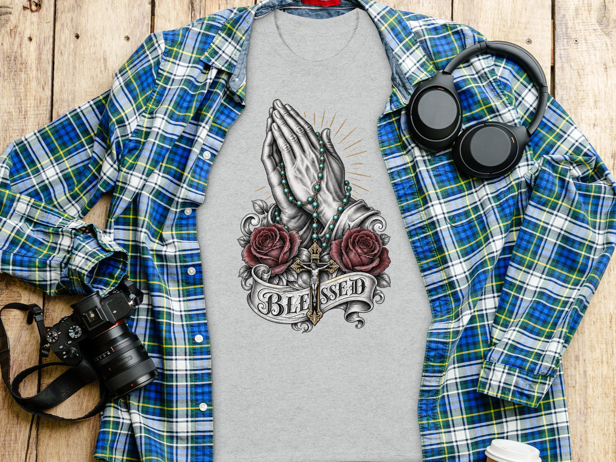 Grey t-shirt with praying hands, rosary, cross, roses, and "BLESSED" text.
