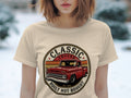 Cream t-shirt with a circular graphic of a red classic truck and text.