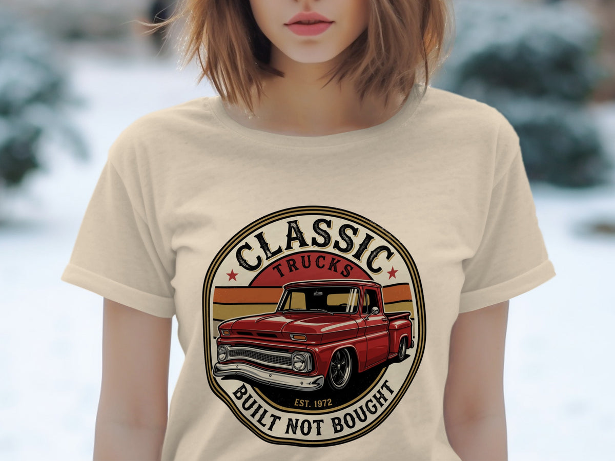 Cream t-shirt with a circular graphic of a red classic truck and text.