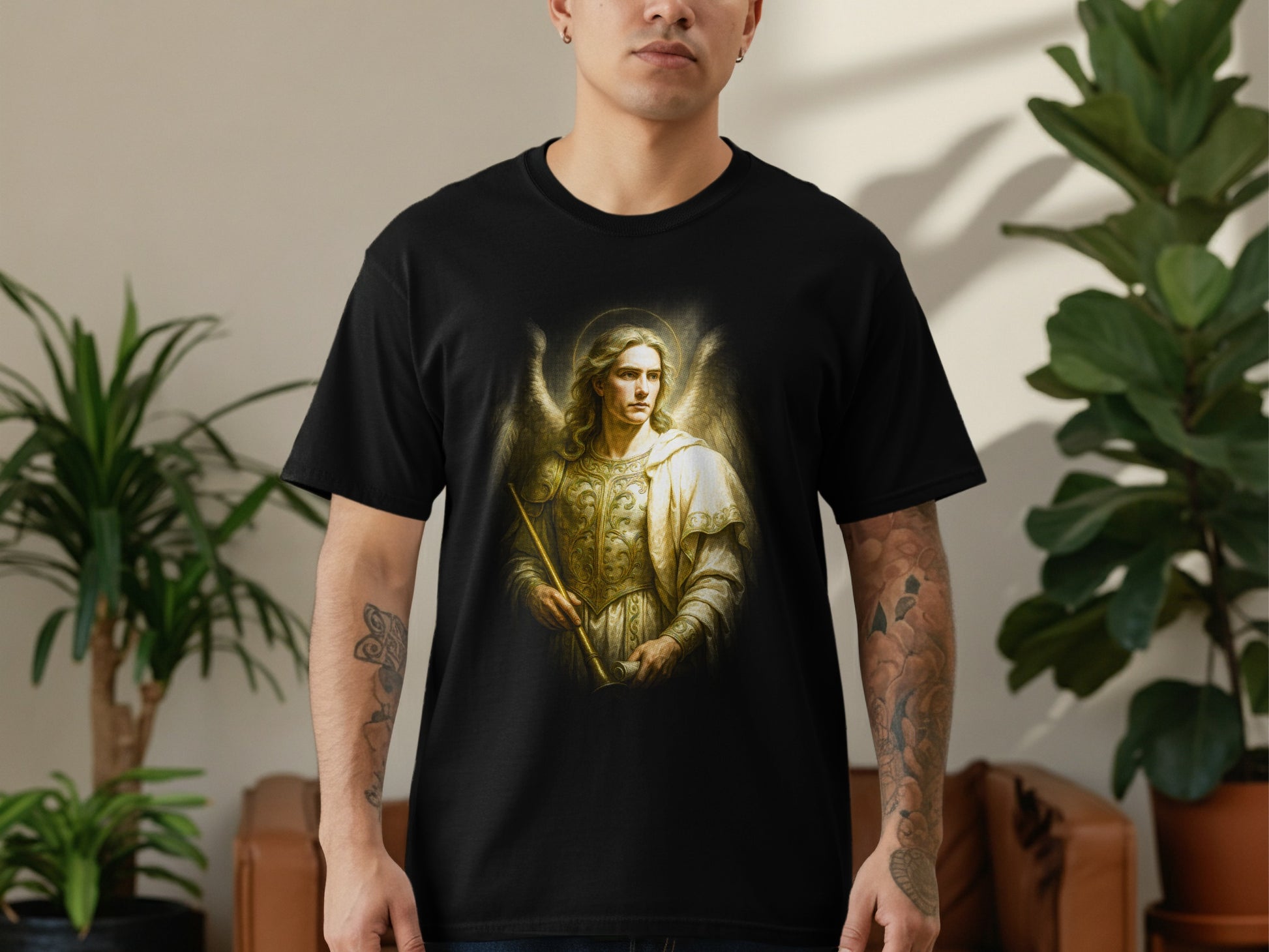 Black t-shirt featuring an angel holding a staff, surrounded by golden light.