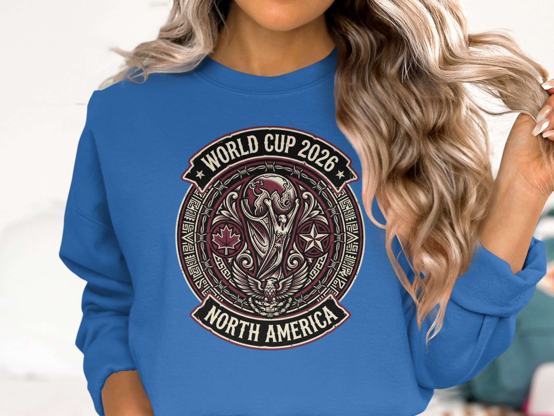 World Cup 2026 North America emblem on a blue sweatshirt.