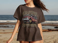 Brown t-shirt with graphic of a red lowrider truck and text 