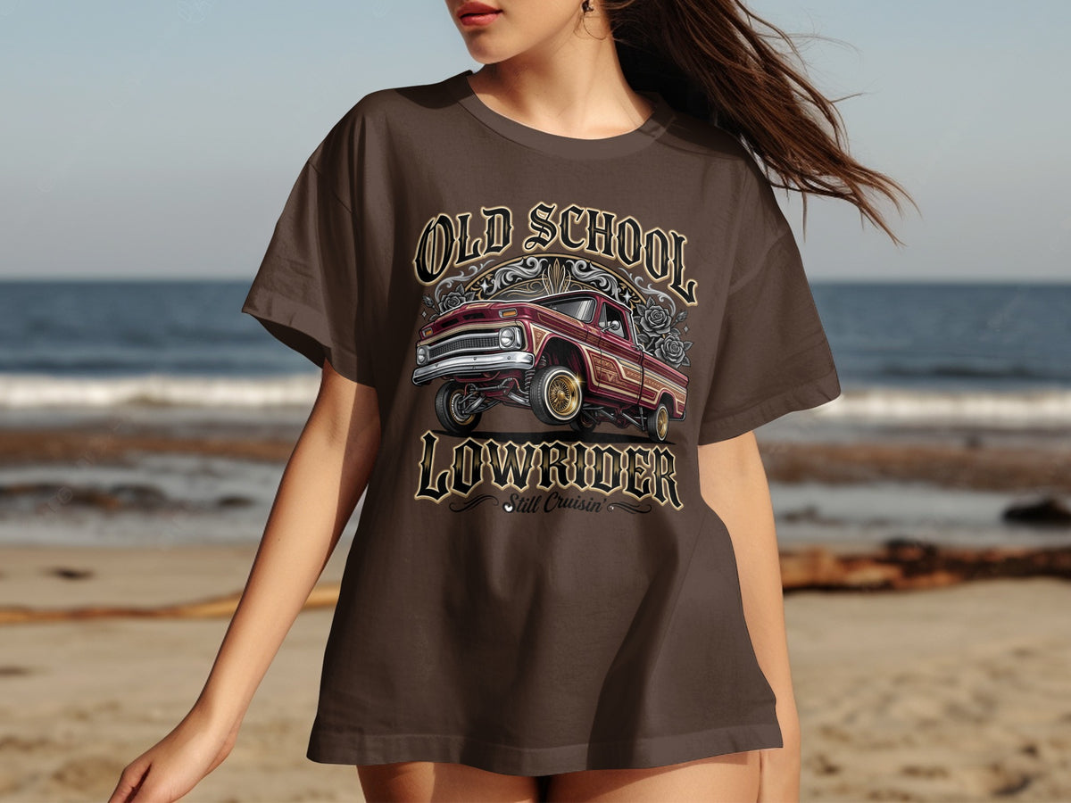 Brown t-shirt with graphic of a red lowrider truck and text "Old School Lowrider Still Cruisin'".