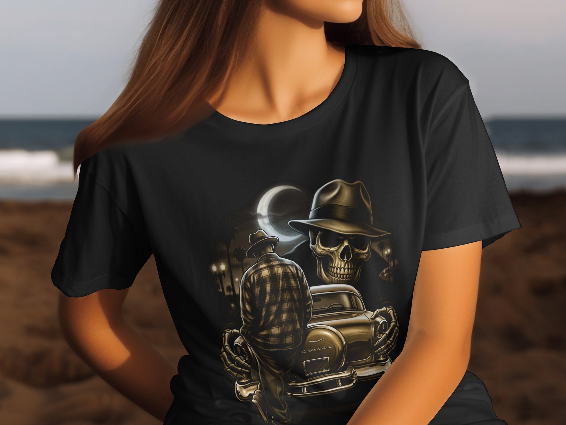 T-shirt with skull in hat, vintage car, and moon over ocean.