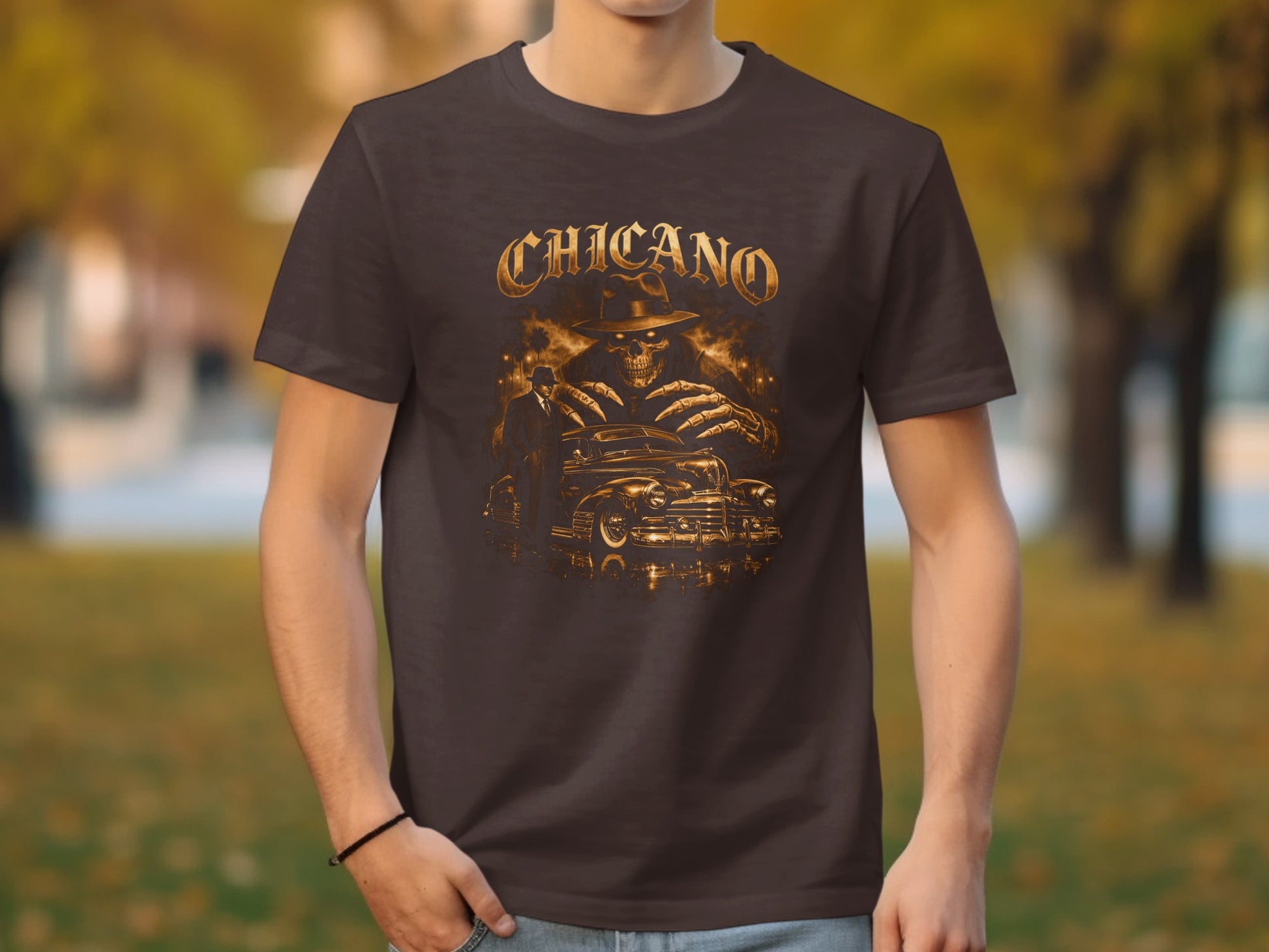 Chicano graphic t-shirt featuring a skeleton in a hat and a vintage car.