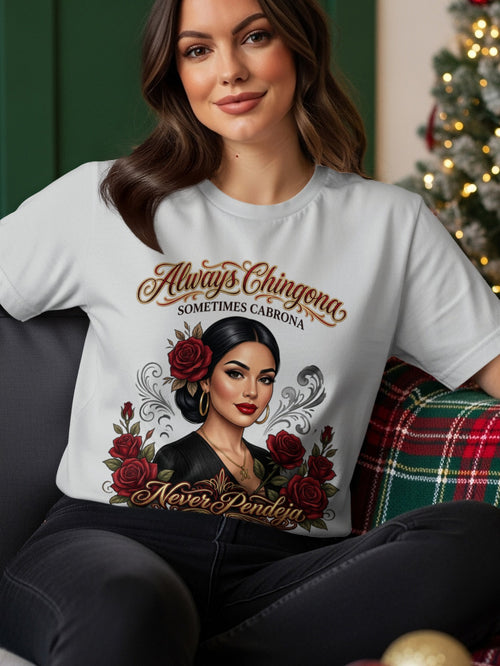 Woman wearing white t-shirt with "Always Chingona Sometimes Cabrona Never Pendeja" and roses.