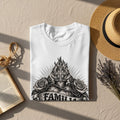 White t-shirt with a black and white graphic of a heart, cross, roses, and 