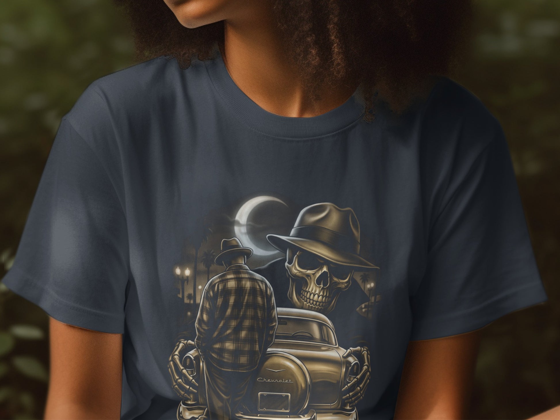 Skeleton in fedora with plaid shirt backs into car under moonlight.
