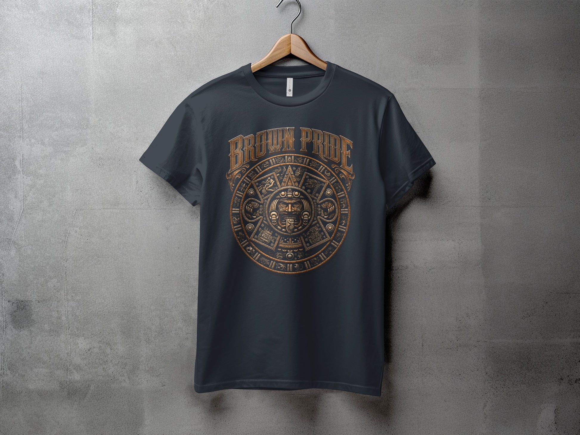 Dark t-shirt with a bronze Aztec sun calendar graphic.