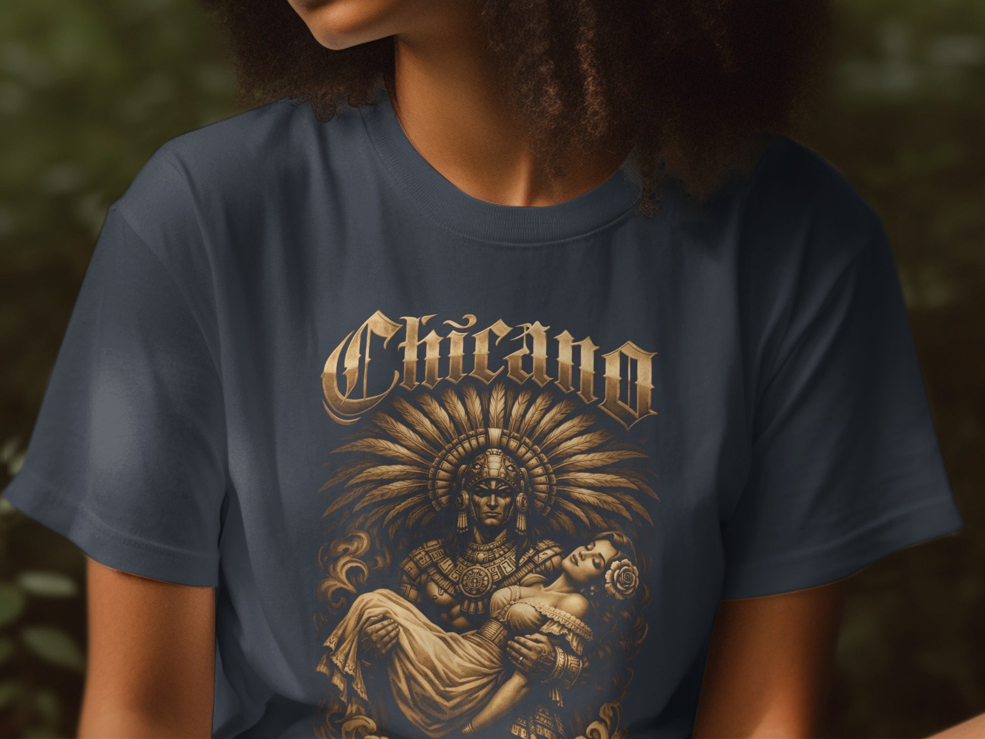Chicano t-shirt featuring a warrior carrying a woman with a feathered headdress.