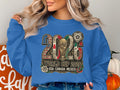 Blue sweatshirt with 2026 World Cup logo, flags, and soccer ball.