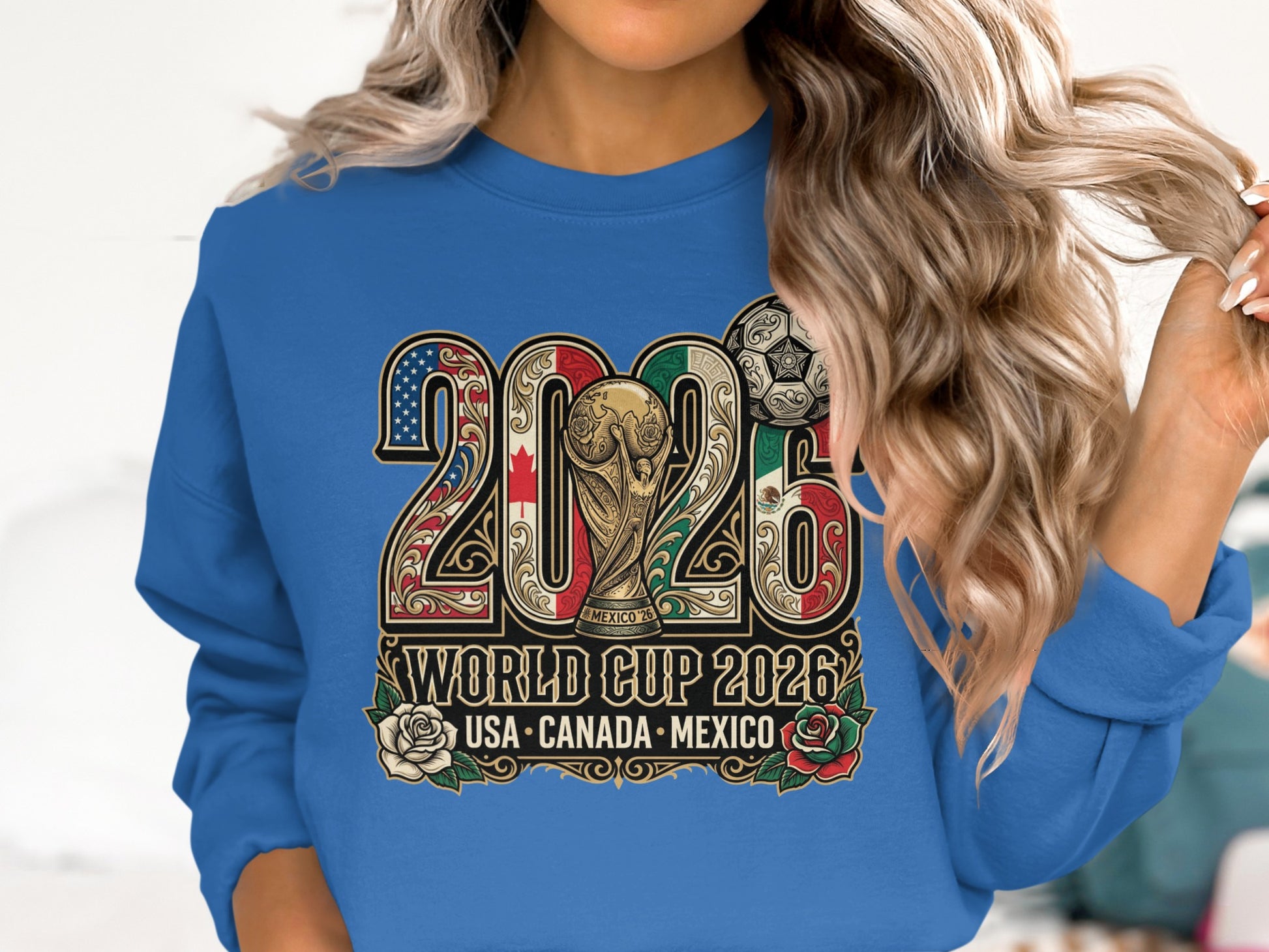 Blue sweatshirt with "2026 World Cup USA-Canada-Mexico" text and trophy.