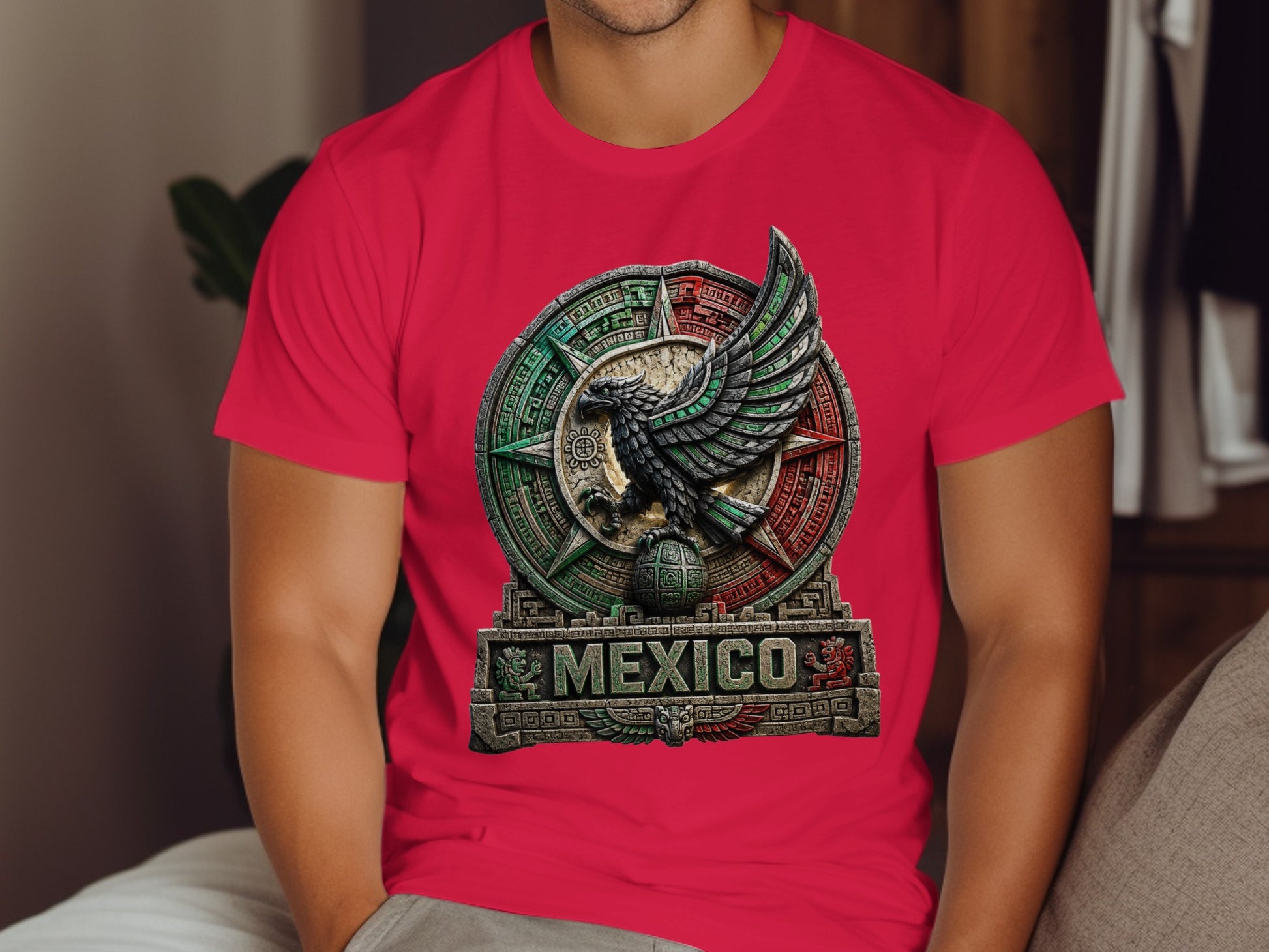 Red t-shirt with circular Aztec-inspired eagle emblem and "MEXICO" text.