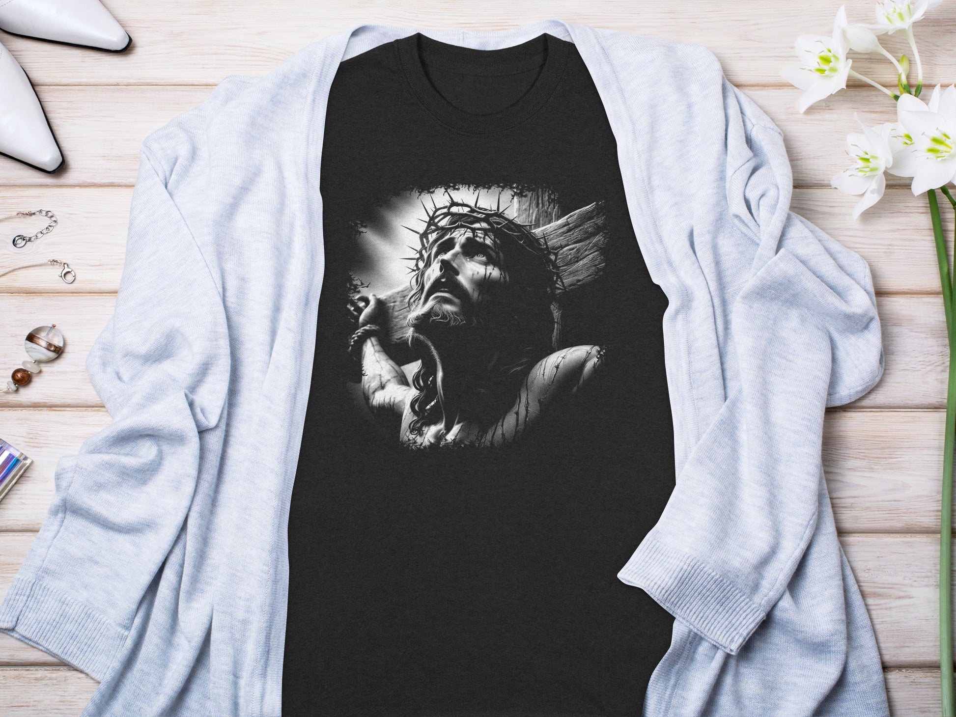 Black t-shirt featuring a grayscale illustration of Jesus Christ on the cross.