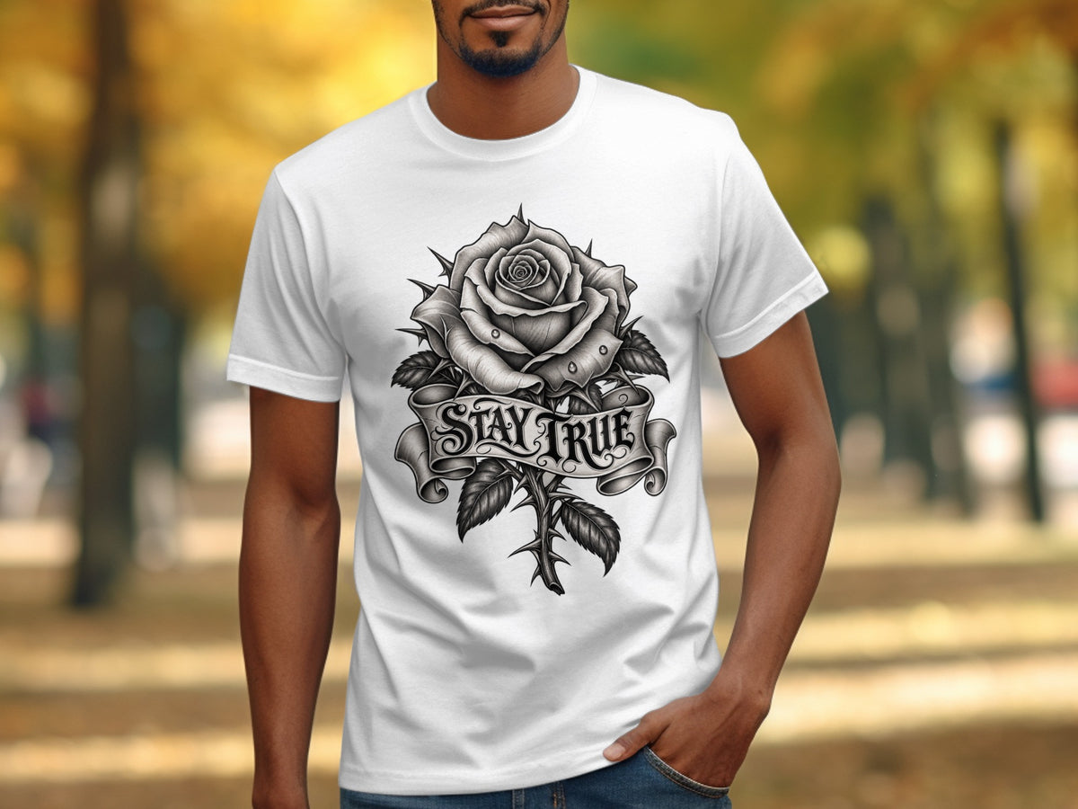 White t-shirt with a black and white rose and thorny stem design, featuring a banner with "STAY TRUE".