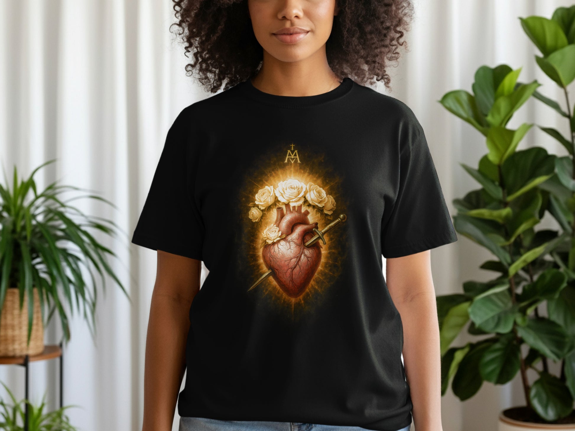 Black t-shirt featuring a Sacred Heart with sword, surrounded by roses.