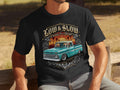 Black t-shirt with Low & Slow graphic featuring a teal Chevrolet truck and sunset.