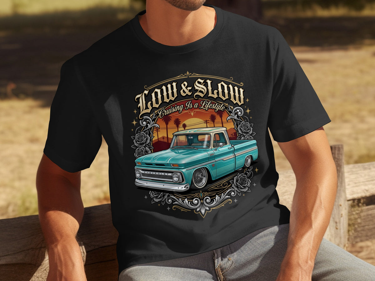 Black t-shirt with Low & Slow graphic featuring a teal Chevrolet truck and sunset.