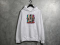 Light grey hooded sweatshirt with cartoon raccoon graphic and text 