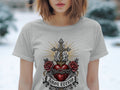 Grey t-shirt with a religious graphic of a heart, roses, cross, and text 