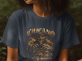Dark t-shirt with a graphic of a skeletal figure in a hat and a classic car.
