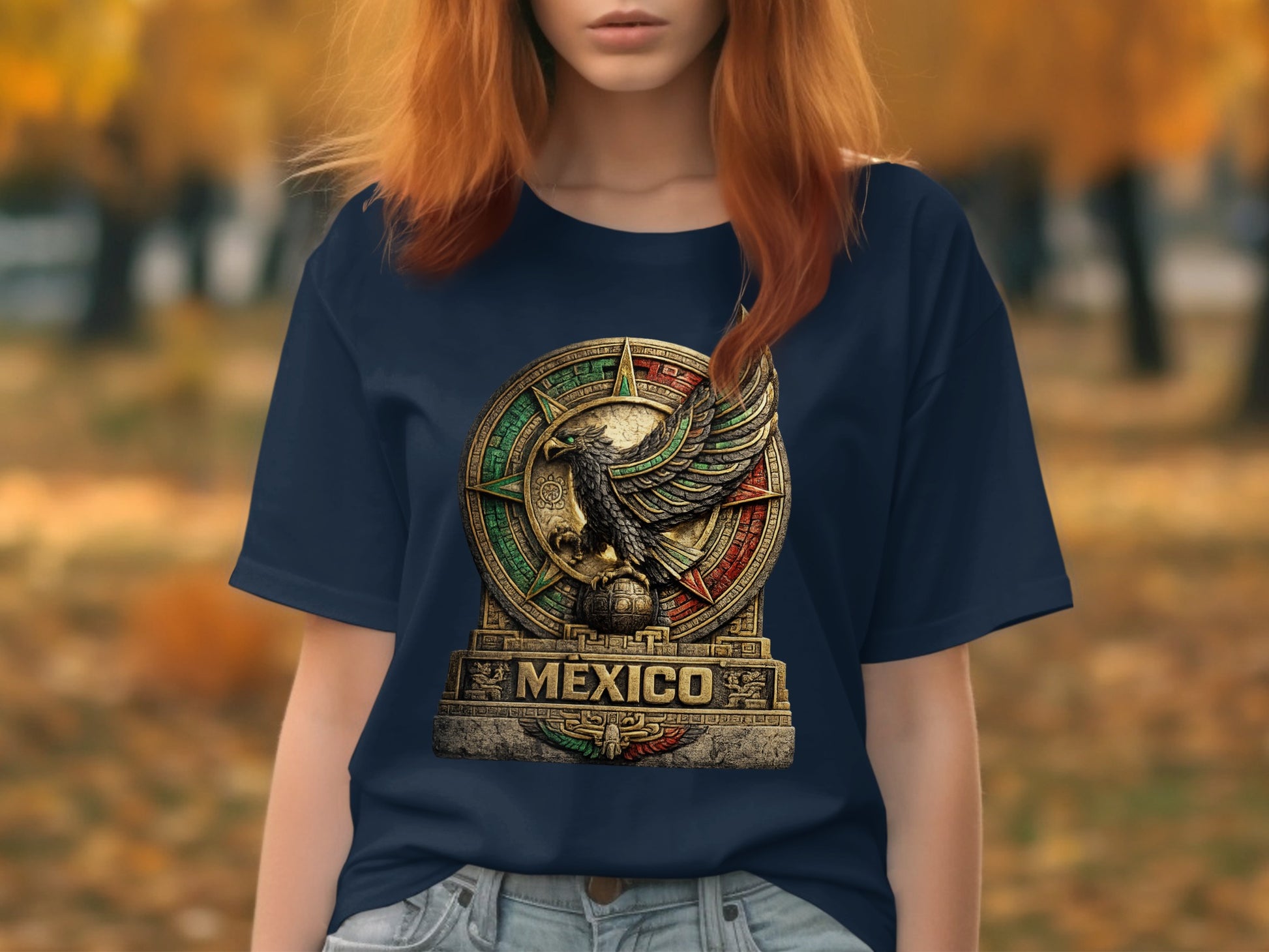 Navy t-shirt featuring a detailed coat of arms of Mexico on a stone monument.