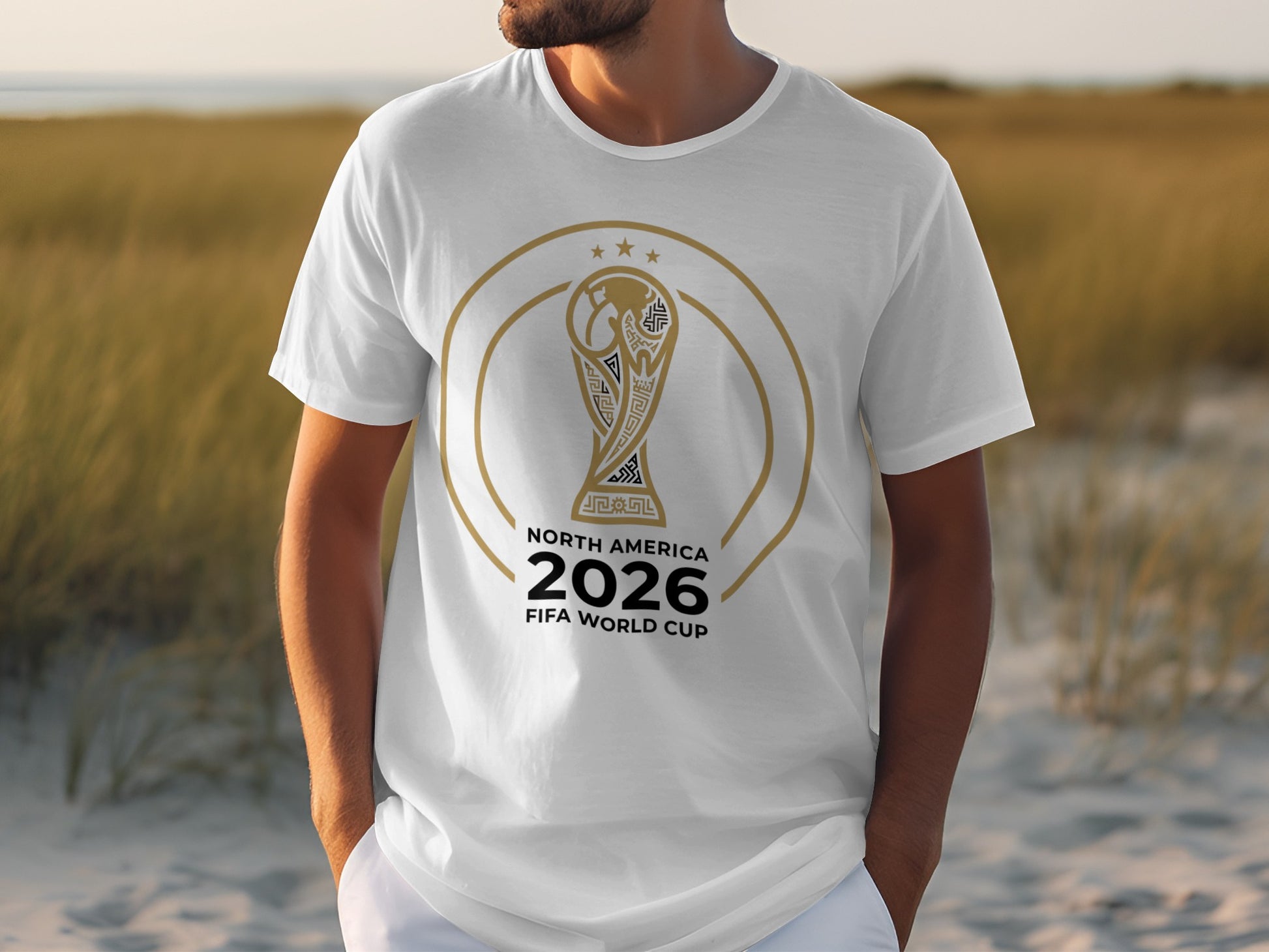 White t-shirt with gold FIFA World Cup 2026 trophy graphic and text.