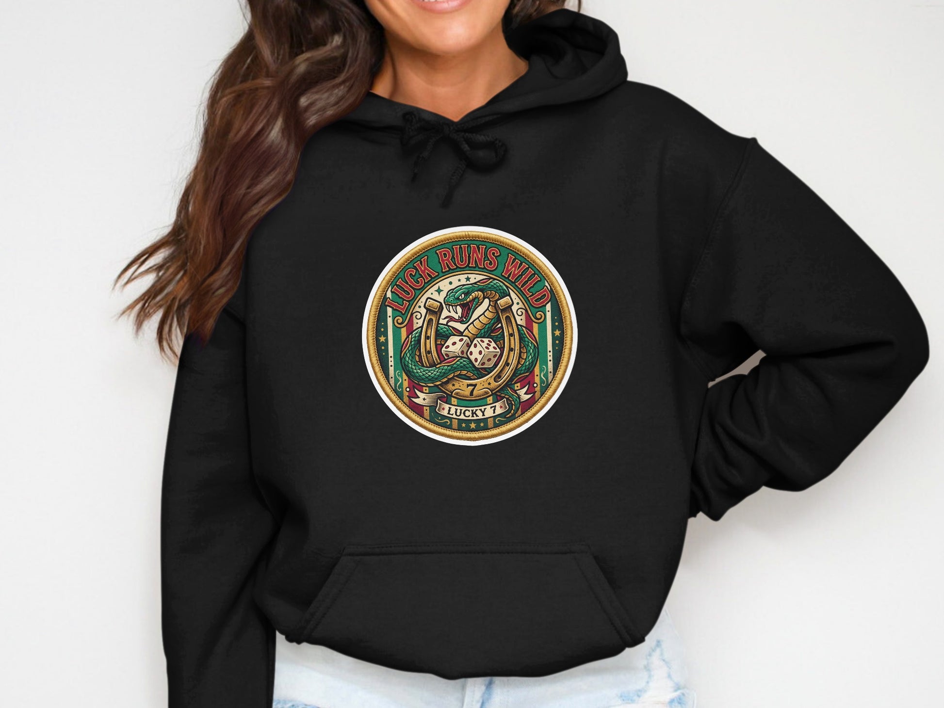 Black hoodie with circular graphic of lucky charms including dice and horseshoe.