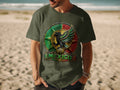 Man wearing olive green t-shirt with Mexican eagle emblem.