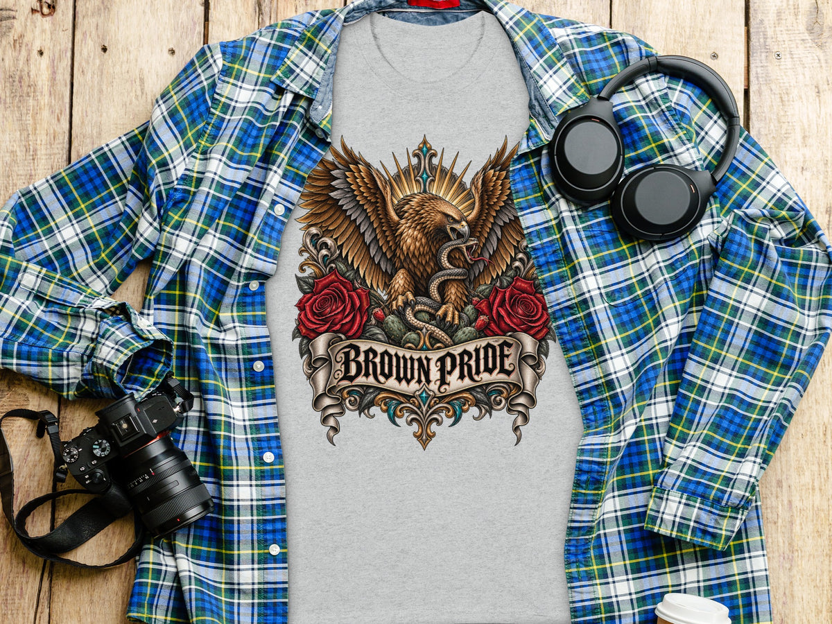 Grey t-shirt with eagle, snake, roses, and "BROWN PRIDE" text graphic.