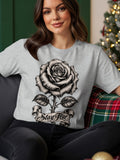 Light grey t-shirt with a black and white rose and banner that says 
