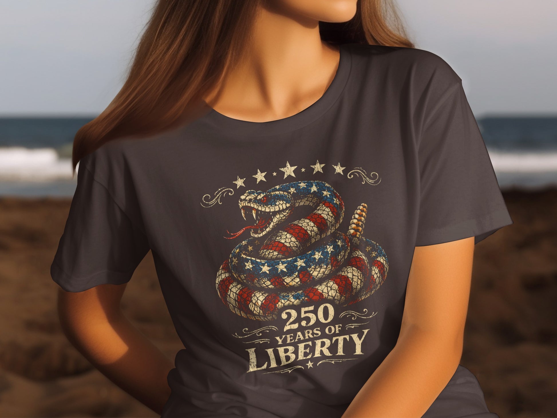 T-shirt with coiled snake in American flag pattern and "250 Years of Liberty" text.