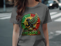 T-shirt with circular Mexican eagle emblem, featuring green, red, and gold accents.