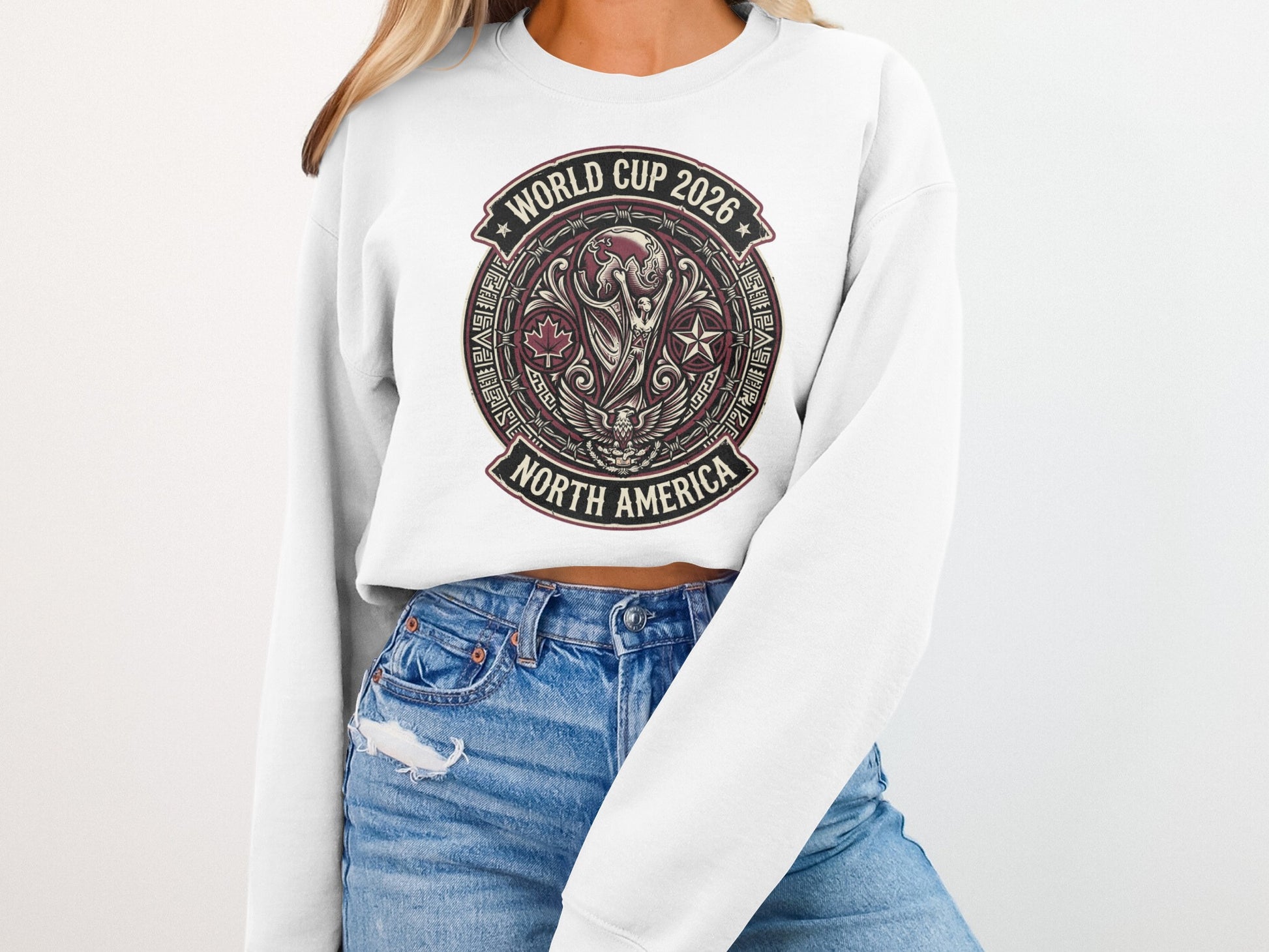 World Cup 2026 North America emblem on a white sweatshirt.