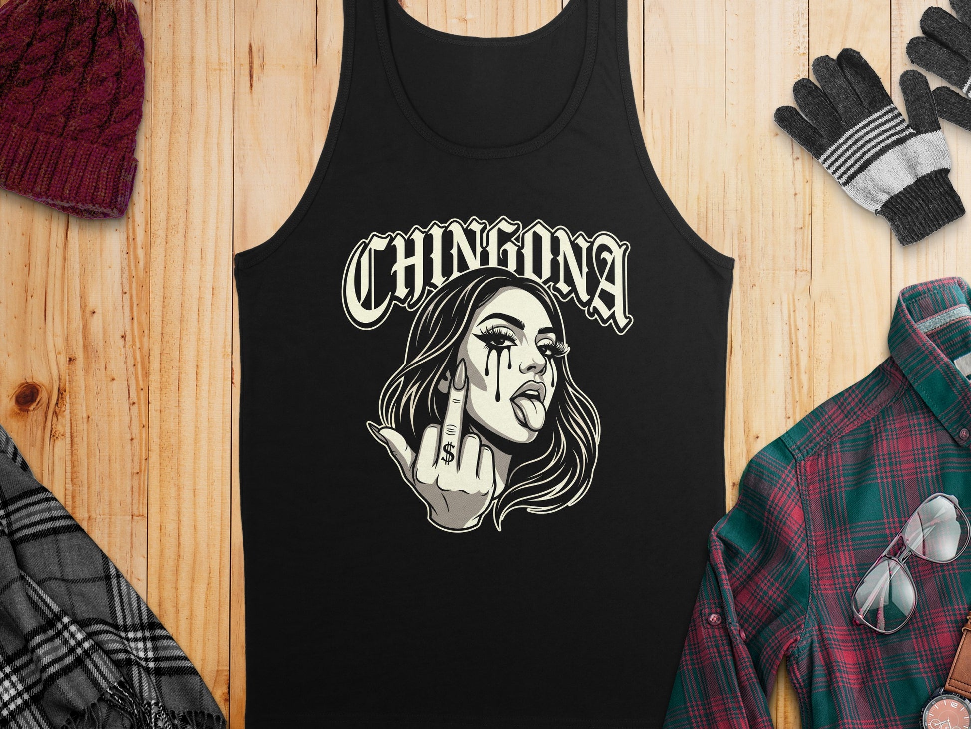 Black tank top with "CHINGONA" text and a woman with dollar sign tattoo on cheek.