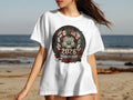 White t-shirt with 2026 World Cup logo featuring flags and soccer ball.