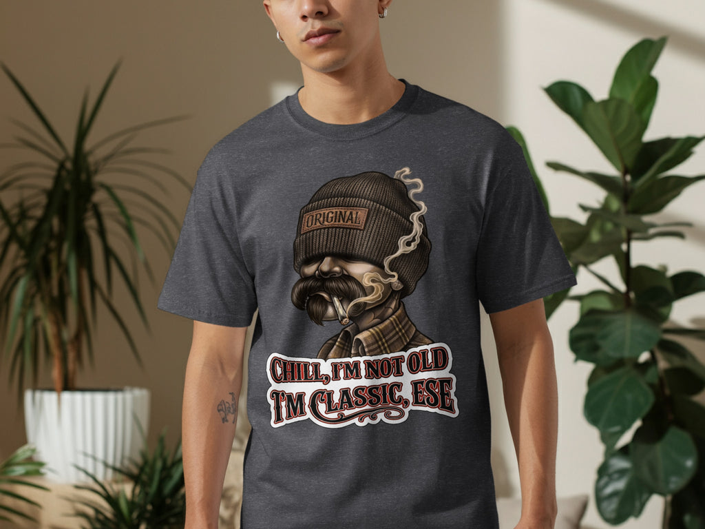 Dark gray t-shirt with graphic of man wearing beanie, mustache, and text "CHILL, I'M NOT OLD I'M CLASSIC, ESE".