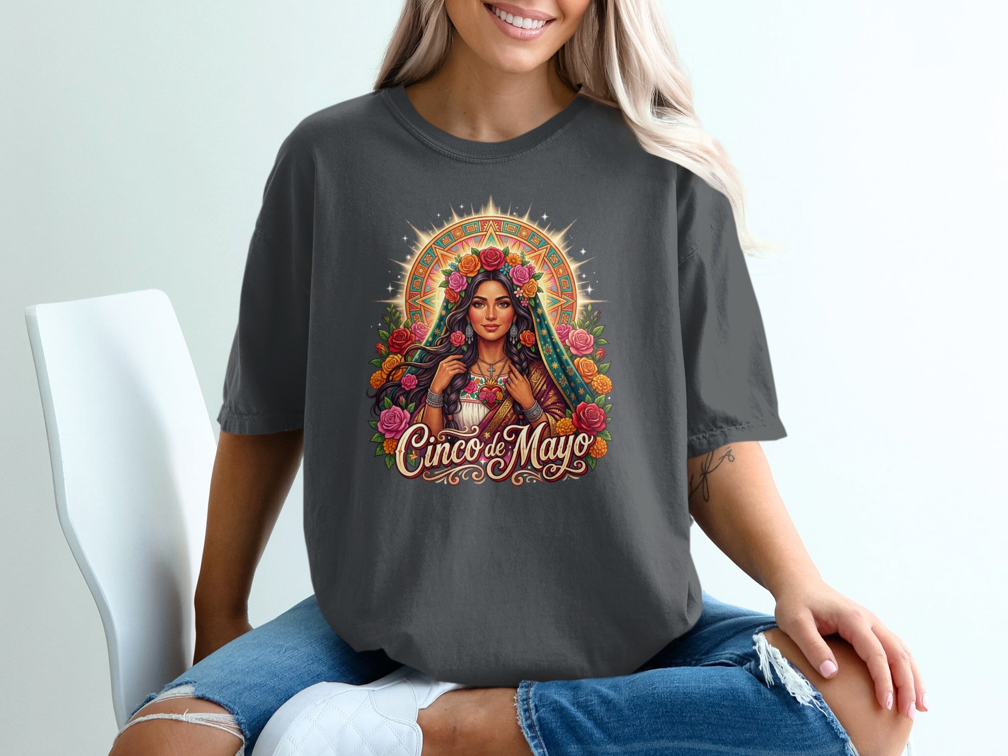 T-shirt with graphic of woman wearing floral headdress, Cinco de Mayo text.