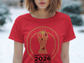Red t-shirt with North America 2026 FIFA World Cup trophy graphic.