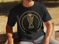 Black t-shirt with gold 2026 FIFA World Cup logo and 